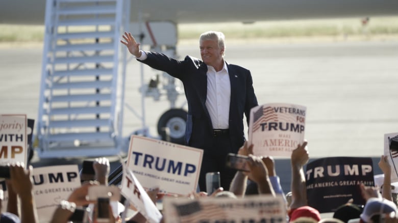 Republican presidential candidate Donald Trump waves to the crowd as he arrives to speak at a rally Wednesday, June 1, 2016, in Sacramento, Calif. 
